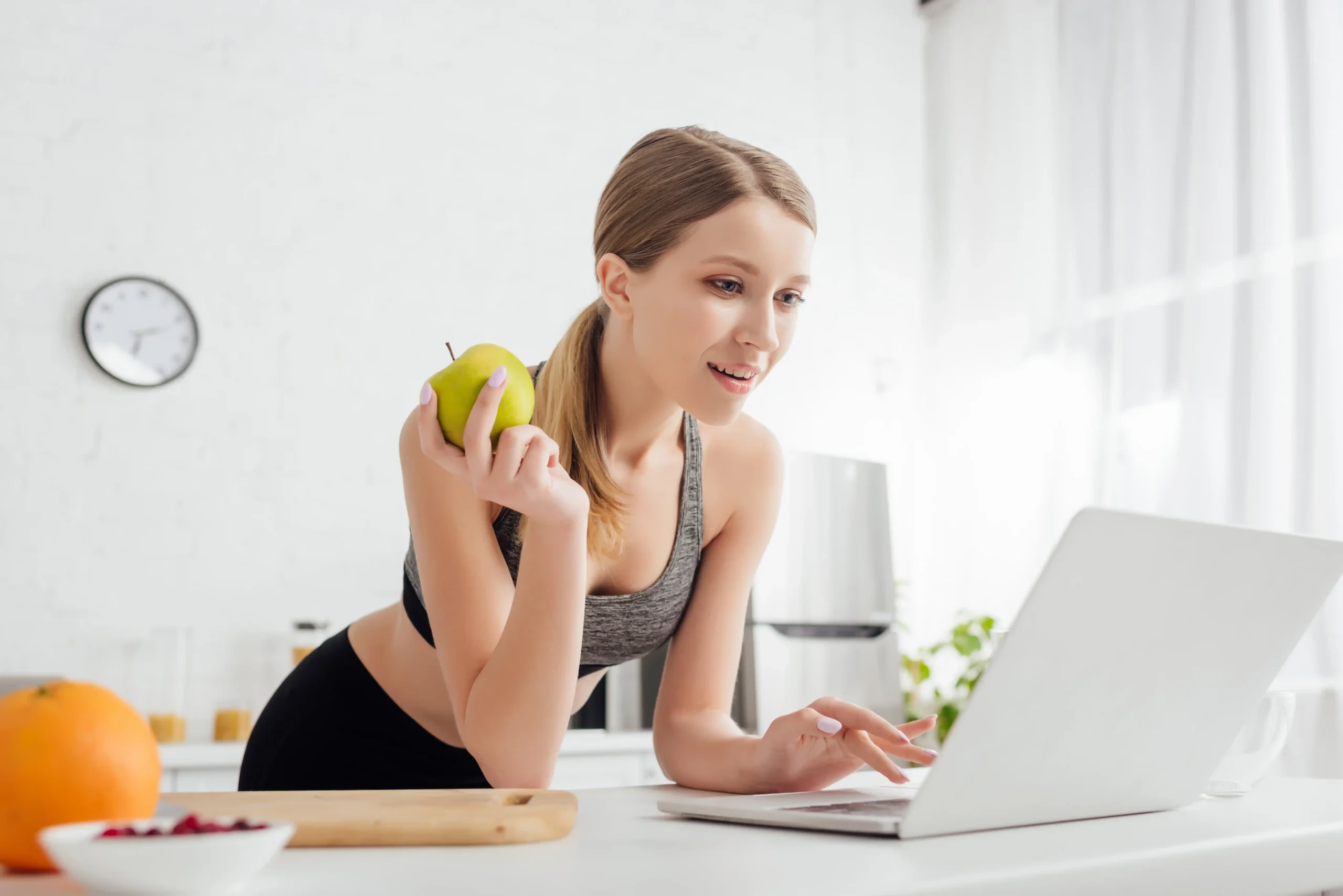 woman with apple using laptop in kitchen 2026 01 09 12 28 25 utc 11zon woman with apple using laptop in kitchen 2026 01 09 12 28 25 utc 11zon
